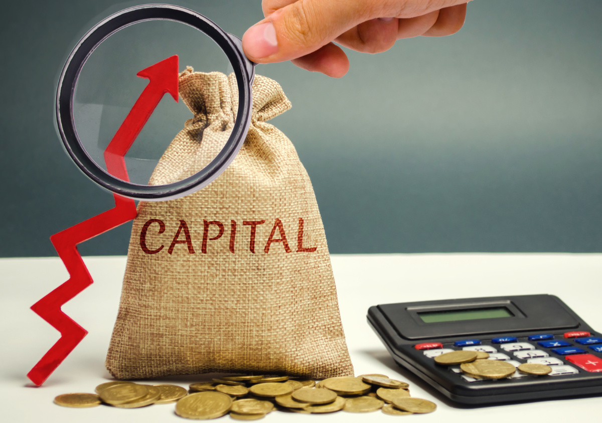 Magnifying glass, change on a counter, calculator, S&P Capital Investment